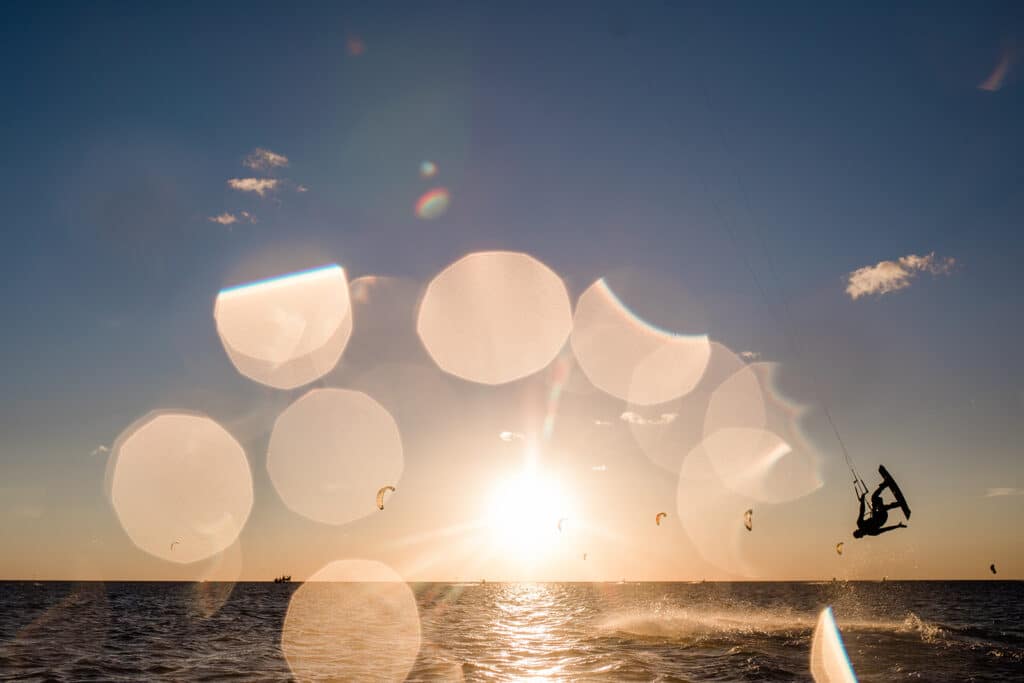 Kitesurfing flip in the outer banks sound at sunset.